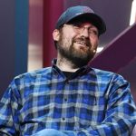 Cardano-oprichter Charles Hoskinson lacht op foto tijdens Web Summit