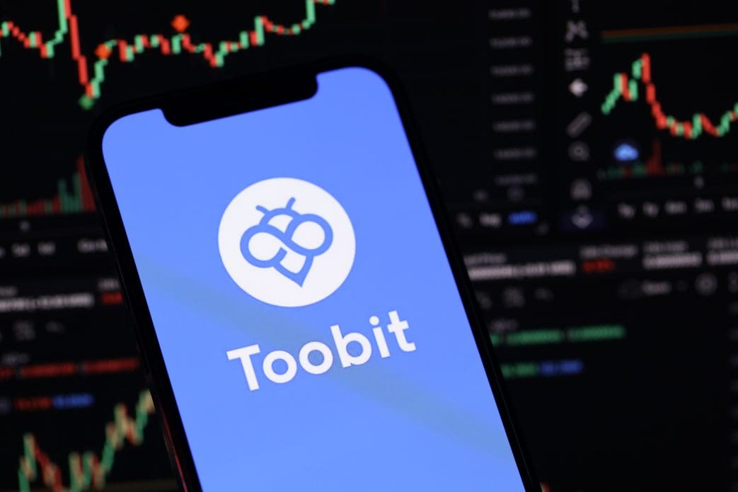 Toobit exchange telefoon koers op achtergrond