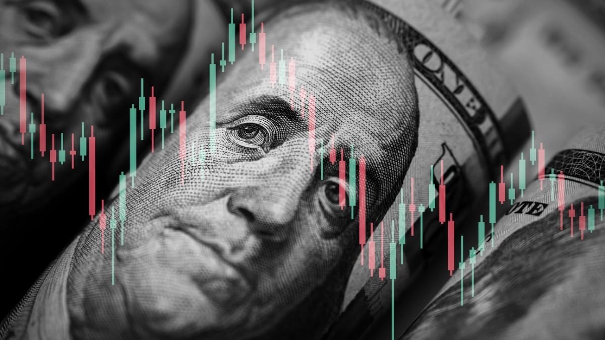 Een afbeelding van Amerikaanse dollars (USD) met daarbij een grafiek van een koers van een aandeel of crypto