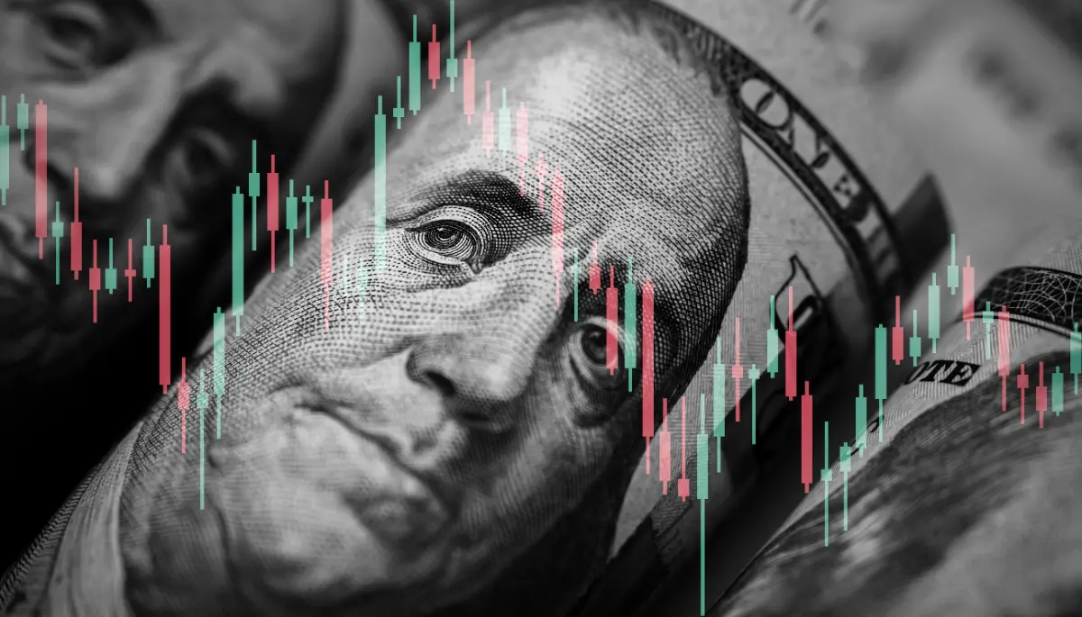 Een afbeelding van Amerikaanse dollars (USD) met daarbij een grafiek van een koers van een aandeel of crypto