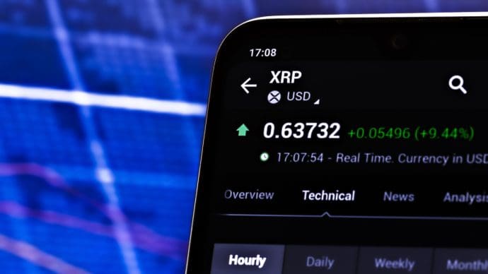 Een afbeelding van de XRP koers en de pagina van de munt van Ripple op een cryptobeurs Een afbeelding van de XRP koers en de pagina van de munt van Ripple op een cryptobeurs