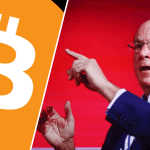 Larry Fink wijst naar bitcoin logo