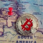 Een afbeelding van een bitcoin (BTC) munt bij het land Venezuela in zuid amerika