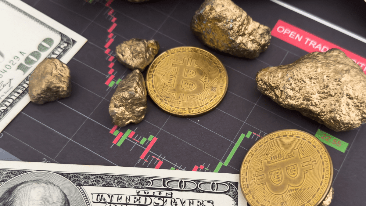 Bitcoins goudklompen dollars en een koersgrafiek